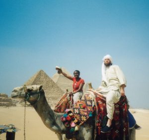Scribe on camel back in Egypt with Dayze